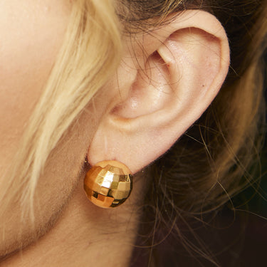 Gold Disco Ball Stud Earrings on Model's Ear