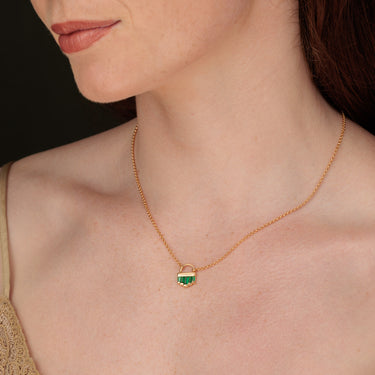 Woman Wearing Gold Emerald Green Art Deco Pendant Necklace