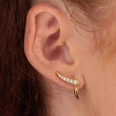 Gold Pearl Ear Climber with a Claw Drop worn in ear lobe