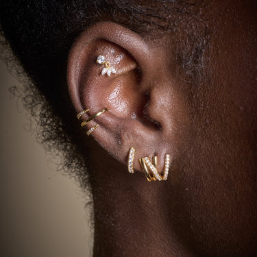 Gold Princess Flat Back Labret Stud Earring worn in the upper cartilage ear piercing