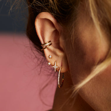 Gold Sparkling Star Ear Jacket Stud Earrings in Ear Stack by Scream Pretty