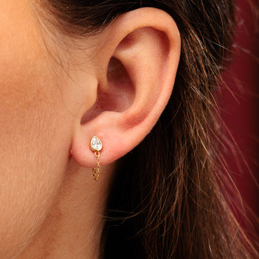 Gold Clear Stone Chained Teardrop Stud Earrings in Earlobe Piercing