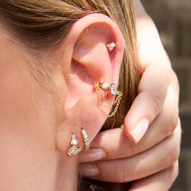 Close Up of Gold Toi Et Moi Chained Ear Cuff with Huggies and Flat Back