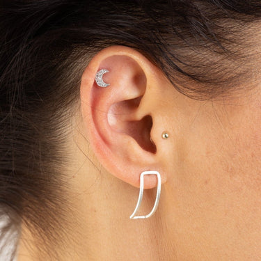 Woman Wearing Silver Sparkling Crescent Moon Stud Earrings | Celestial Inspired Studs