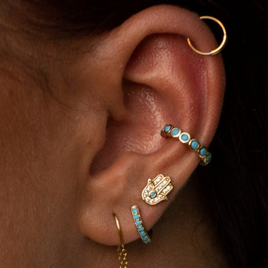Woman Wearing Gold Fatima Stud Earrings | Hand of Fatima Stud Earrings