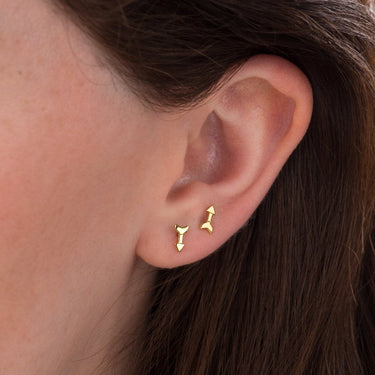 Woman Wearing Gold Arrow Stud Earrings | Minimal Stud Earrings