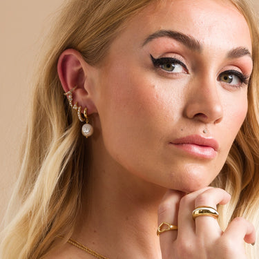 Large Pearl Huggie Earrings worn in second lobe piercing also perfect for conch piercings