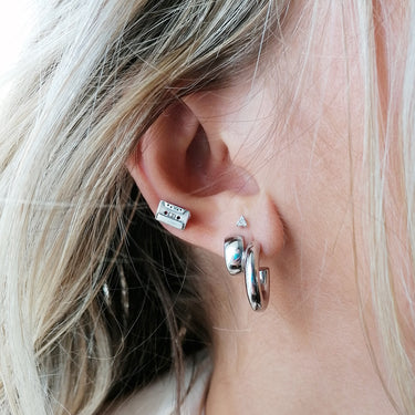 Woman Wearing Silver Mix Tape Stud Earrings | Cassette Tape Studs