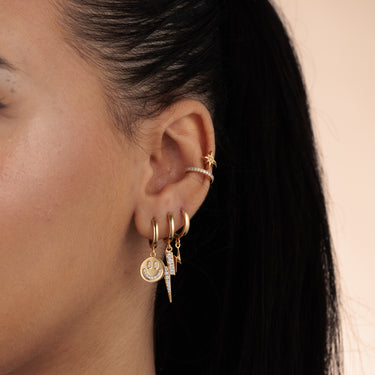 Double band star ear cuff in ear stack. No piercing required.