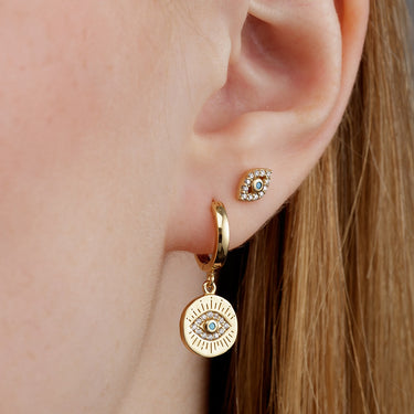 Woman Wearing Gold Evil Eye Stud Earrings & Charm Hoops | Earrings with Evil Eye Symbol