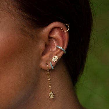 Woman Wearing Gold Fatima Stud Earrings | Hand of Fatima Stud Earrings