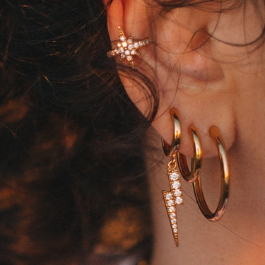 Large huggie in second lobe piercing also perfect for conch piercings