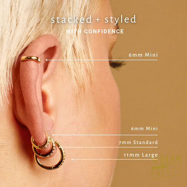 mini huggie earring worn in helix and lobe piercing