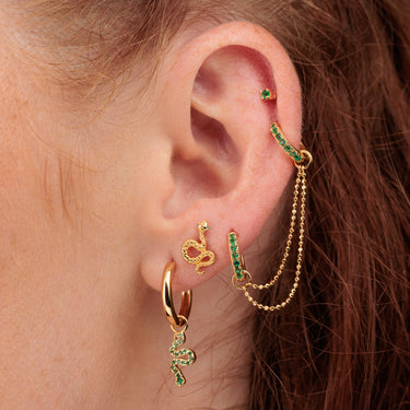 Ear Stack Close-up with Snake Charm Hoops, Snake Stud, Emerald Green Double Huggie and Flat Back Earring in Gold