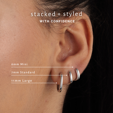3 single hoop earrings in various sizes for cartilage piercings. Rook piercing, helix and conch piercings on Model