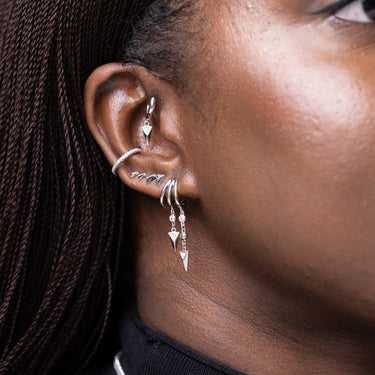 Rebel Charm Hoop Earrings show on model in forward helix piercing