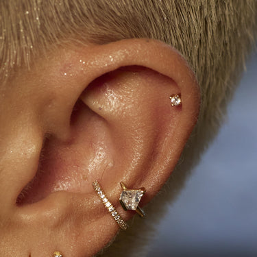 Gold Clear Stone Stud Earrings worn in cartilage ear piercing