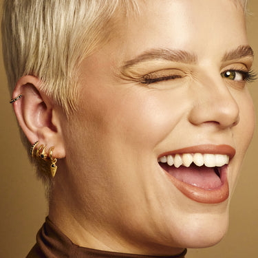 Black Onyx Shield Charm Hoop Earrings shown on model in lobe piercing