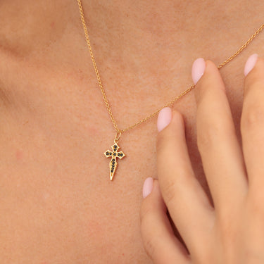 Gold Cross Pendant Necklace with Black Nano Stones on Woman's Neck