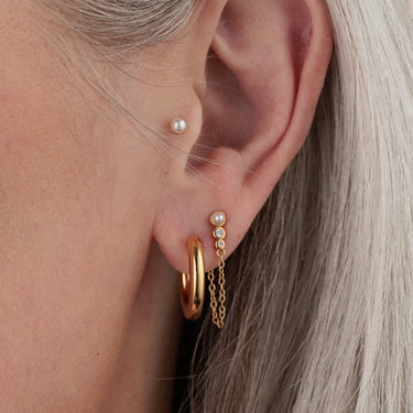 Gold Chunky Classic Hoop Earring in Earlobe with Pearl Studs