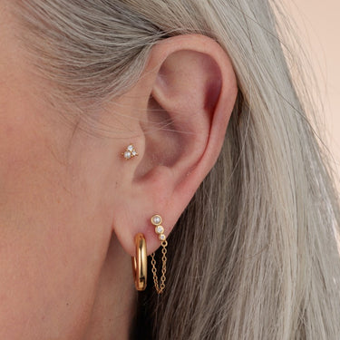 Gold Chunky Pearl Earring Stacking Set in one ear in earlobe and tragus piercing