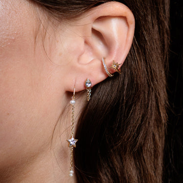 Gold mismatched star threader earrings with teardrop stud and star ear cuff
