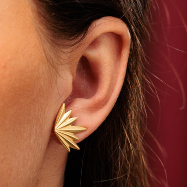 Gold Phoenix Stud Earrings in Model's Ear