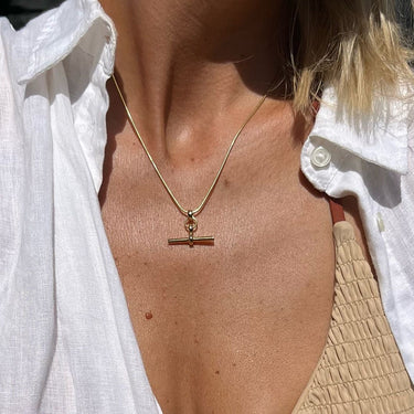 Gold T-Bar Necklace with Snake Chain worn by Kelly Springham