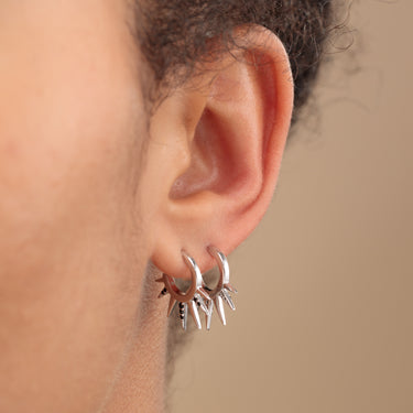 Woman Wearing Silver Black Sun Spike Hoop Earrings | Spiked Hoop Earrings