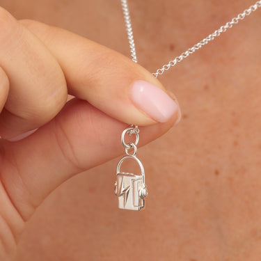 Silver Walkman Cassette Tape Player Charm on Chain in Hands