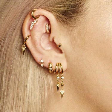 mini huggie earring worn in rook piercing on model