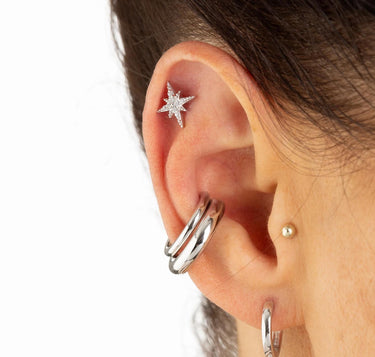 Woman Wearing Silver Sparkling Star Stud Earrings | Star-Shaped Studs with Clear Stones