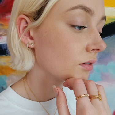 Woman Wearing Gold Bat Stud Earrings | Unique  Thematic Studs