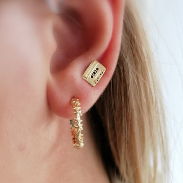 Woman Wearing Gold Mix Tape Stud Earrings | Cassette Tape Studs