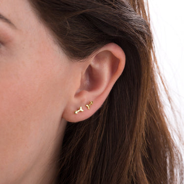Woman Wearing Gold Arrow Stud Earrings | Minimal Stud Earrings