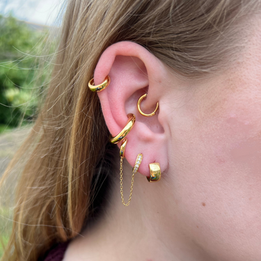 Gold Daith Single Hoop Earring by Scream Pretty in daith piercing on model