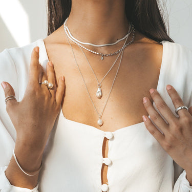 Hand and Pearl Necklace by Scream Pretty