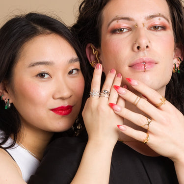 Model's Wearing Silver & Gold Adjustable Snake Ring with Green Stones | Serpent Rings