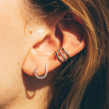 Woman Wearing Silver Tennis Chain Double Stud Earring | Connected Stud Earring