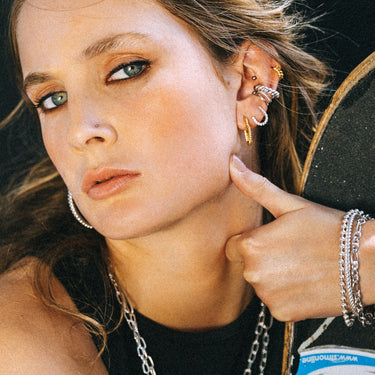 Woman Wearing Silver Tennis Chain Double Stud Earring | Connected Stud Earring