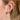 Funkelnder verbundener Huggie-einzelner Ohrring