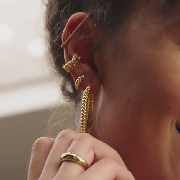 Video of Twist & Shout Chunky Gold Huggie Hoop Earrings on model