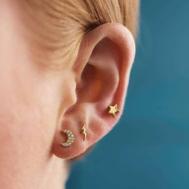 Woman Wearing Gold Dainty Lightning Bolt Stud Earrings | Lightning Shaped Studs